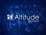 First National ALTITUDE Real Estate Brand on Blue Background
